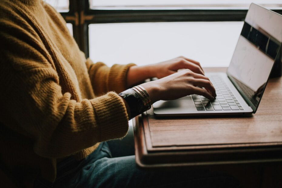 Person typing on a keyboard